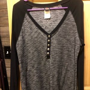 Women’s Harley Davidson Shirt with logo at bottom of shirt in the front